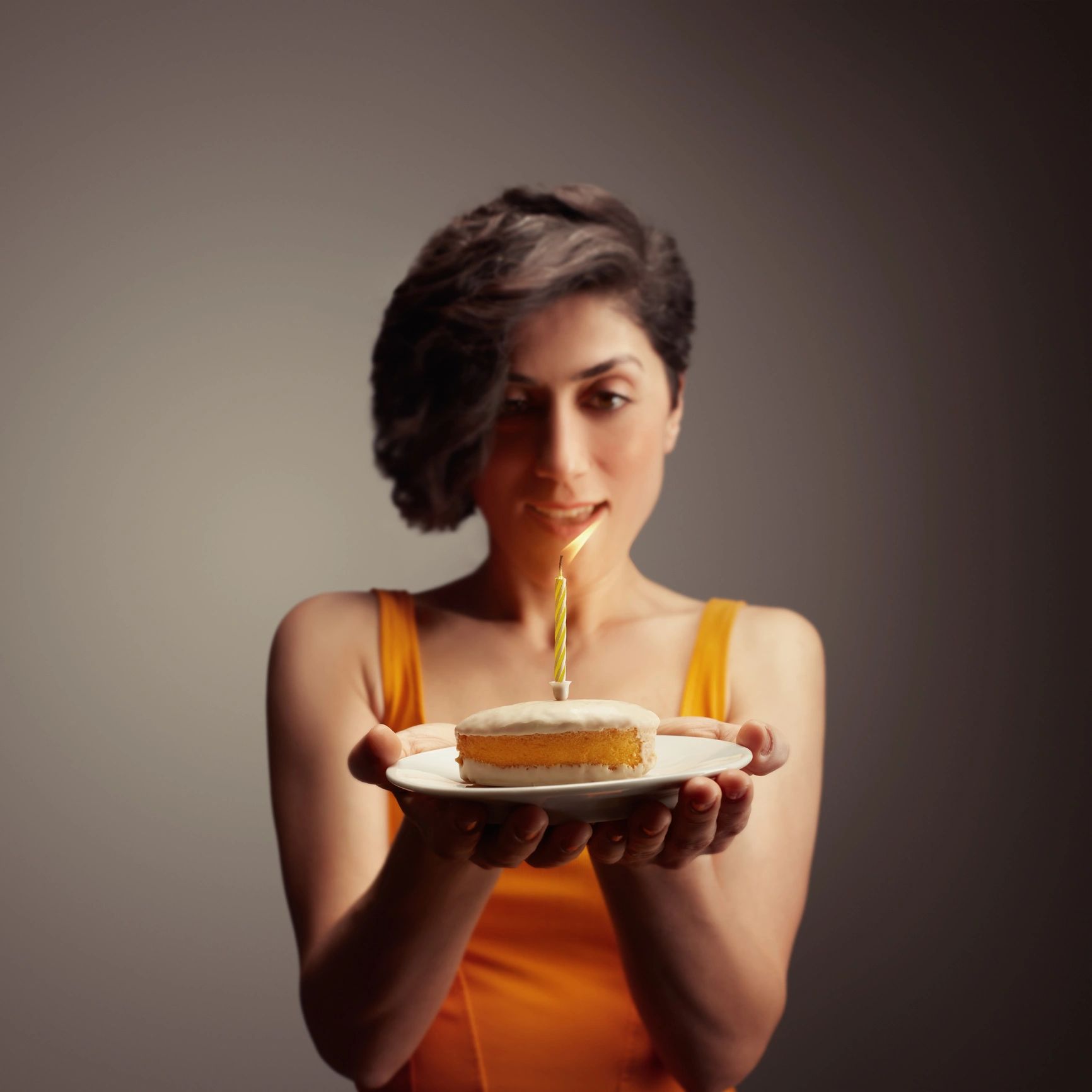 Customer holding a birthday cake