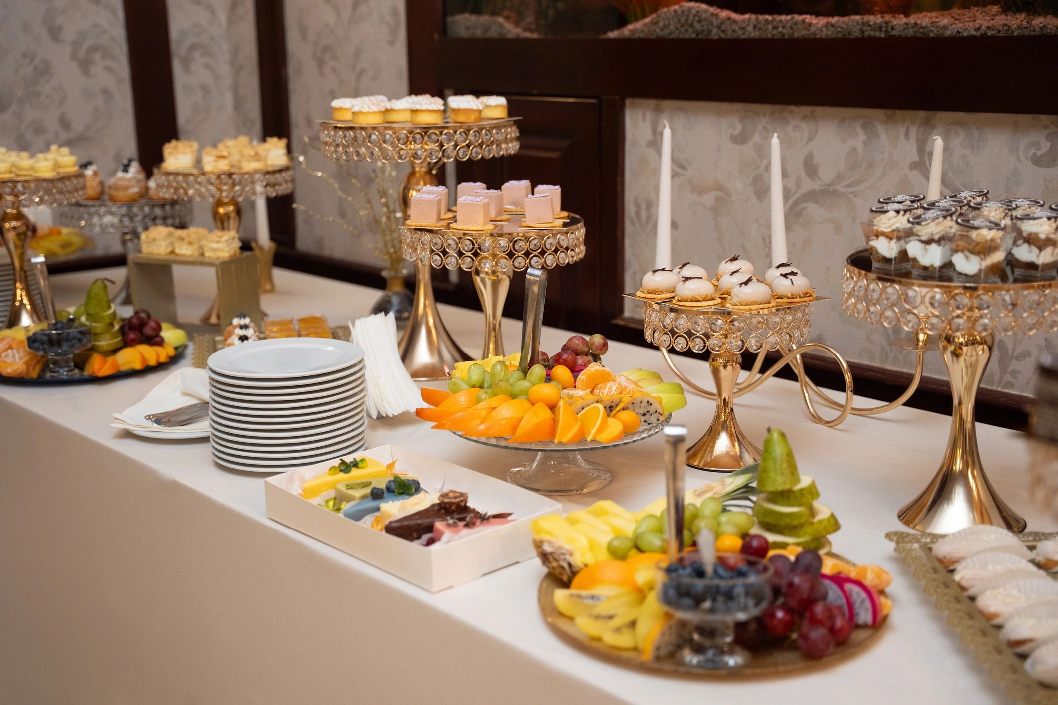 Dessert table with assorted pastries and cakes